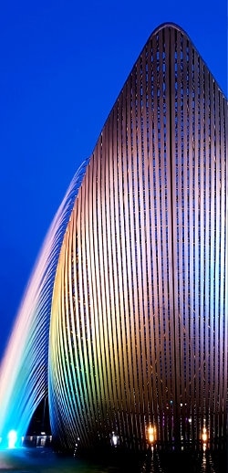 The exterior of the building is decorated with colorful fountains