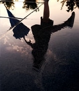 Reflection of the person walking on the water