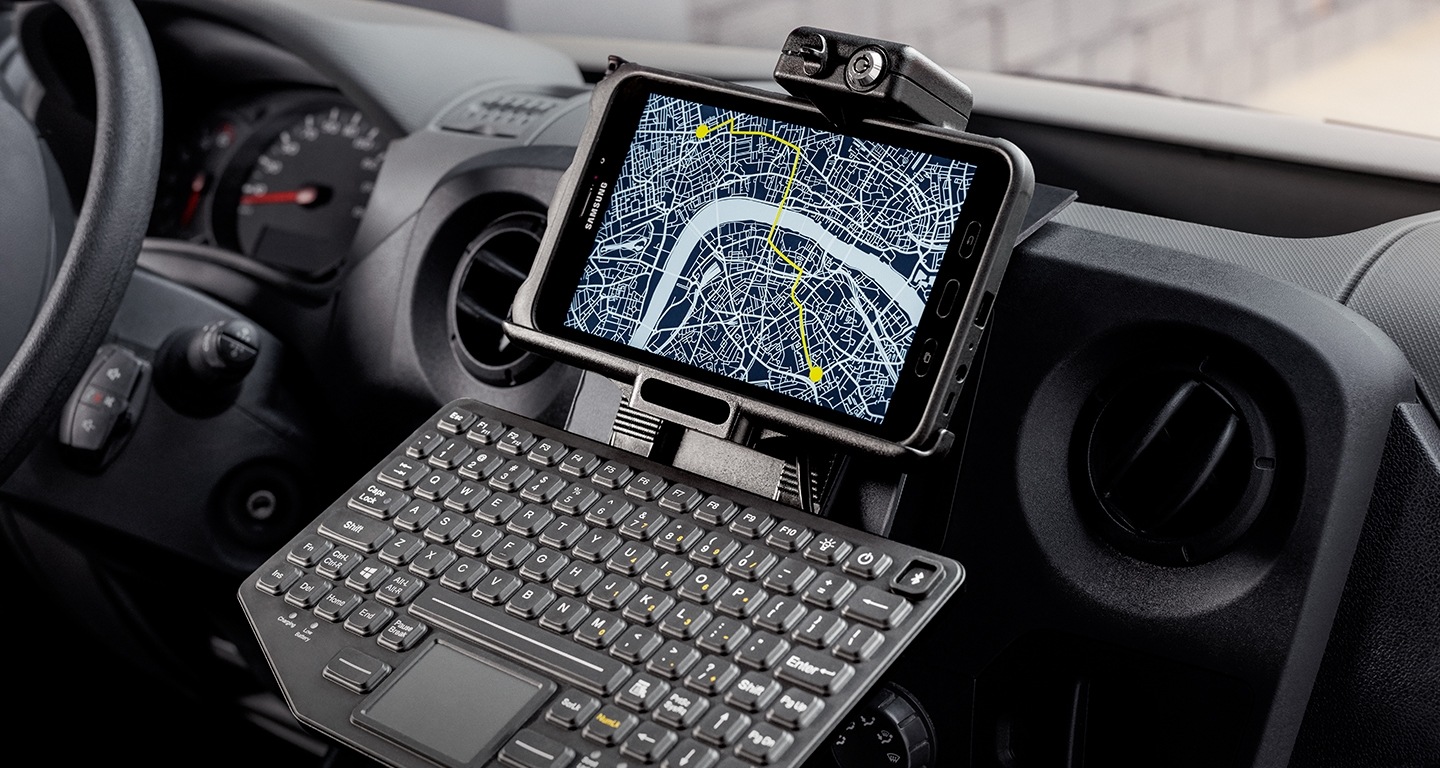 A Samsung tablet mounted on a truck dashboard with a Sat-Nav function on