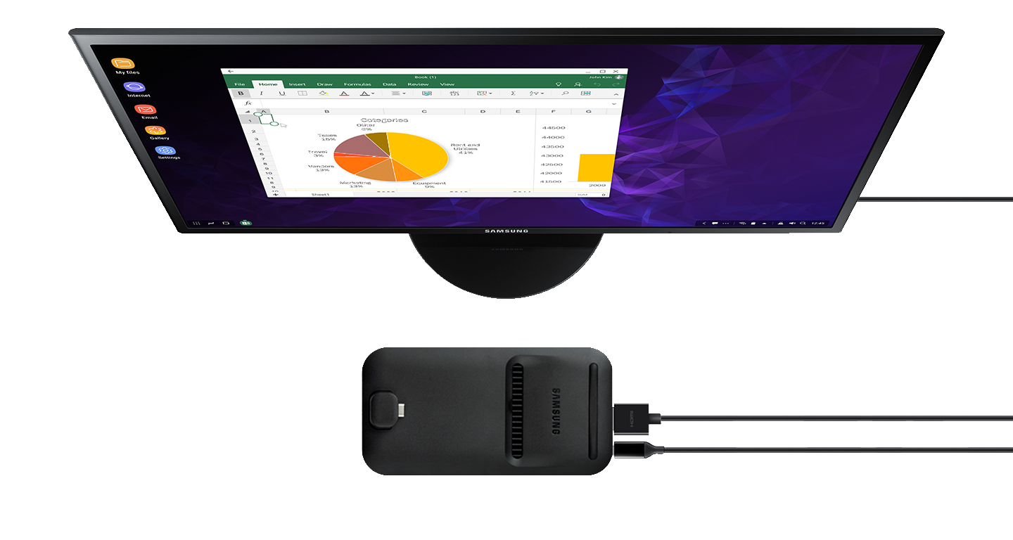 Galaxy S9 or S9+ with a spreadsheet on-screen sliding onto Samsung DeX Pad in front of a Samsung monitor
