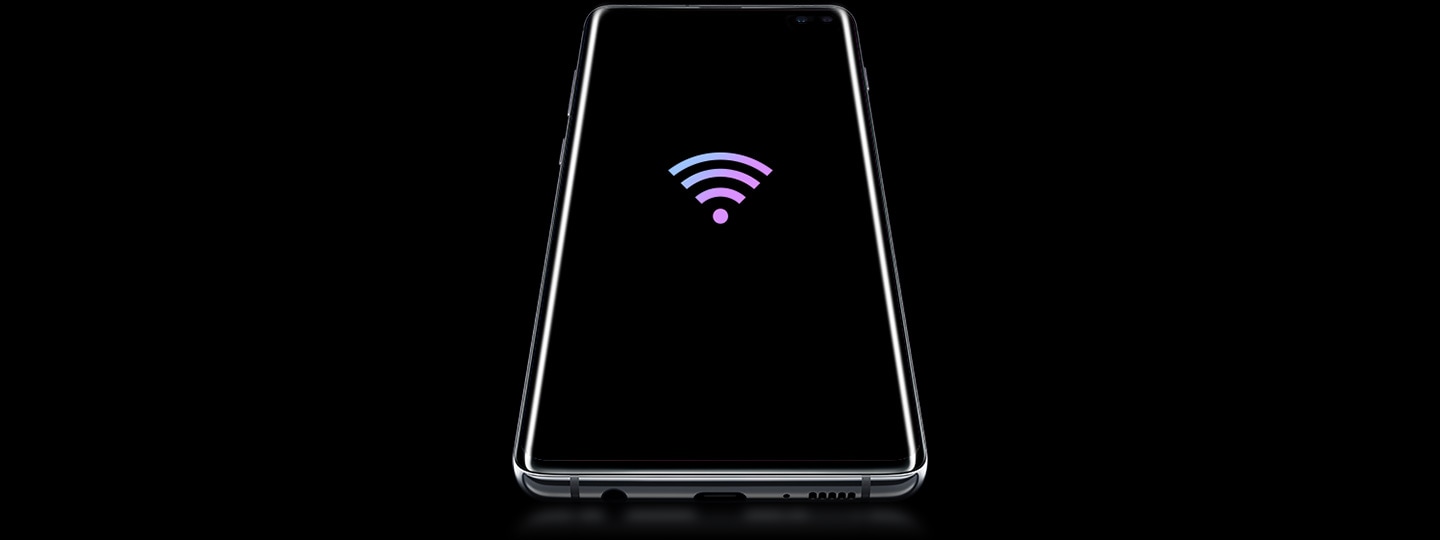 Galaxy S10 plus laying on its back, seen at a slight angle from below, with a prismatic Wi-Fi icon on screen.