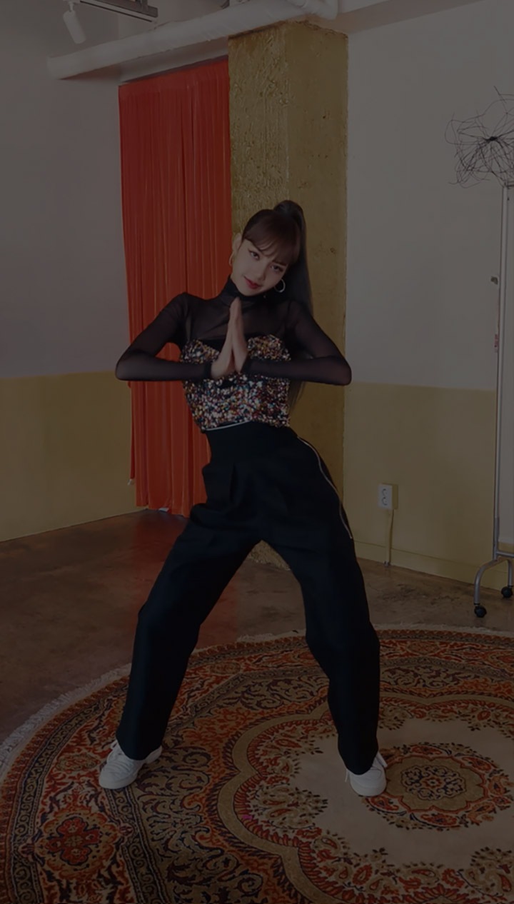 Lisa from BLACKPINK is doing the #danceAwesome dance. She's framed with a Samsung A Series phone and her image is repeated 5 times across this phone frame. On the most left and most right image of Lisa, she has an animated A on her legs. About the Lisa framed in the phone the headline reads, #danceAwesome with BLACKPINK