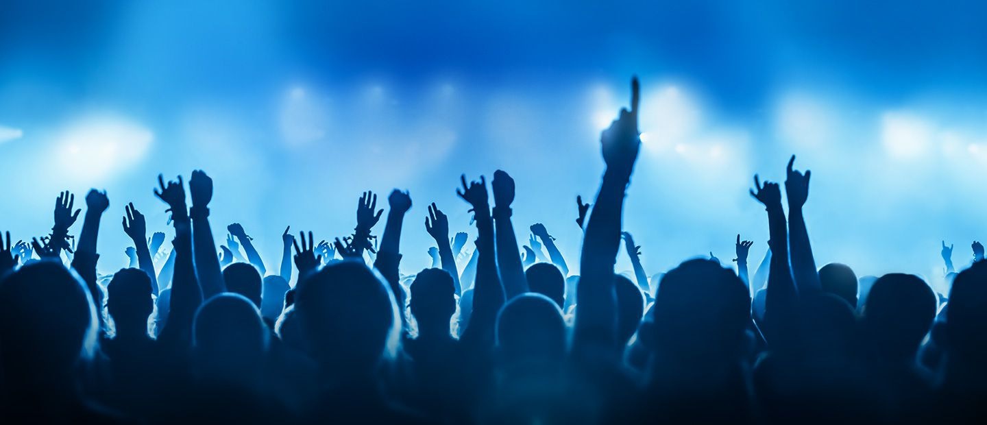 Background image of the crowd at a concert