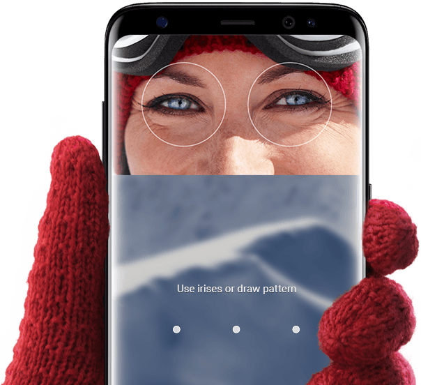 Hand wearing glove holding up Galaxy S8 for iris scanning