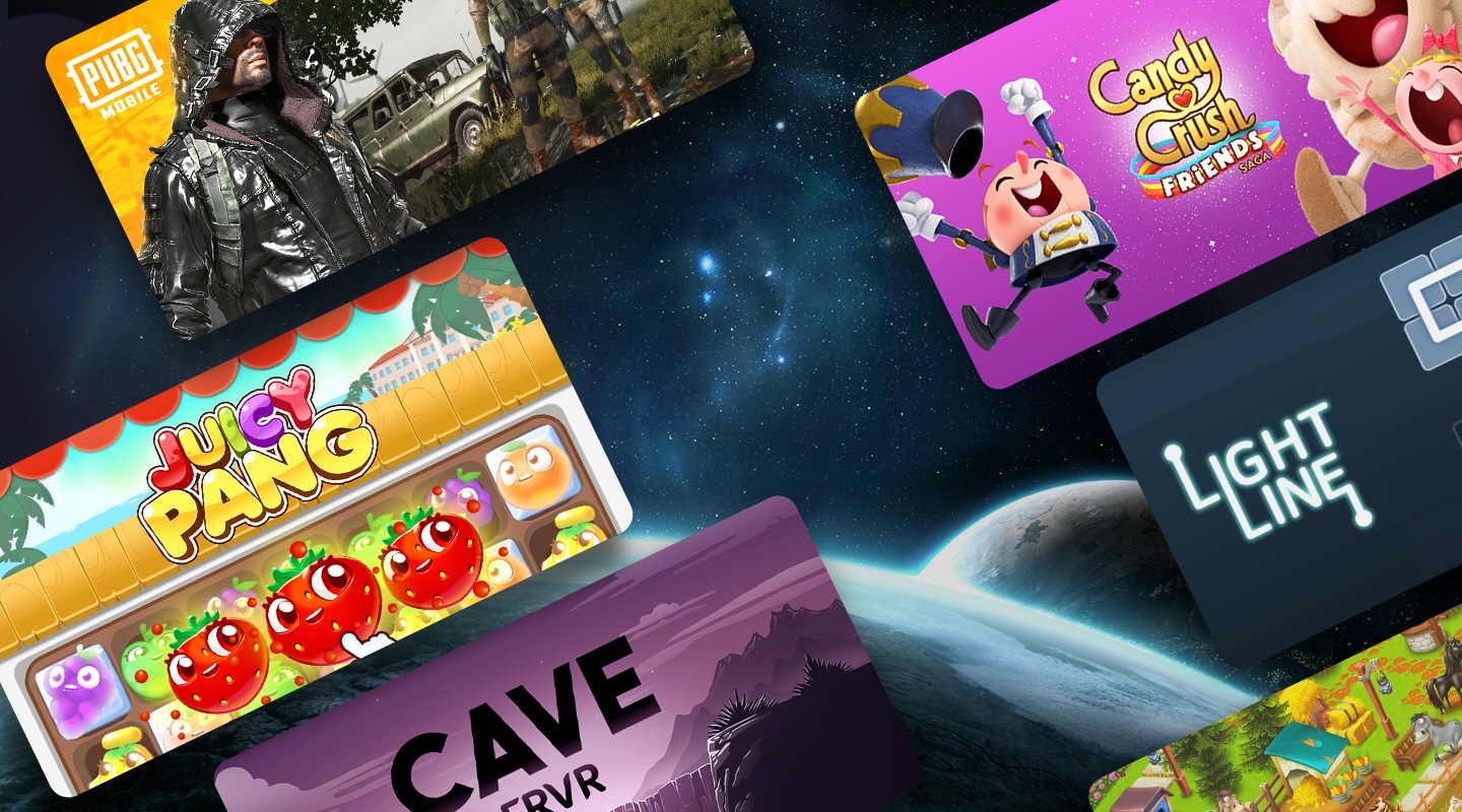 W tle pokazane Ziemia i Księżyc widziane z kosmosu. Na pierwszym planie rozmieszczone są różne miniatury gier. Te gry to PUBG Mobile, Candy Crush Friends Saga, Light Line, Juicy Pang, Cave FRVR i inne.