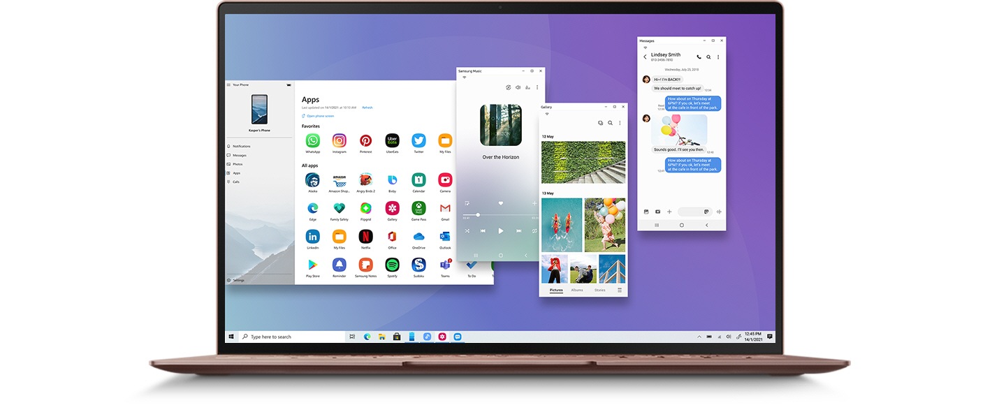 Um ecrã de computador portátil mostra um menu da app do telemóvel Galaxy, fotos e mensagens, conectados através da funcionalidade Link to Windows.