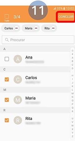 Depois de selecionar os contactos toque em Concluir