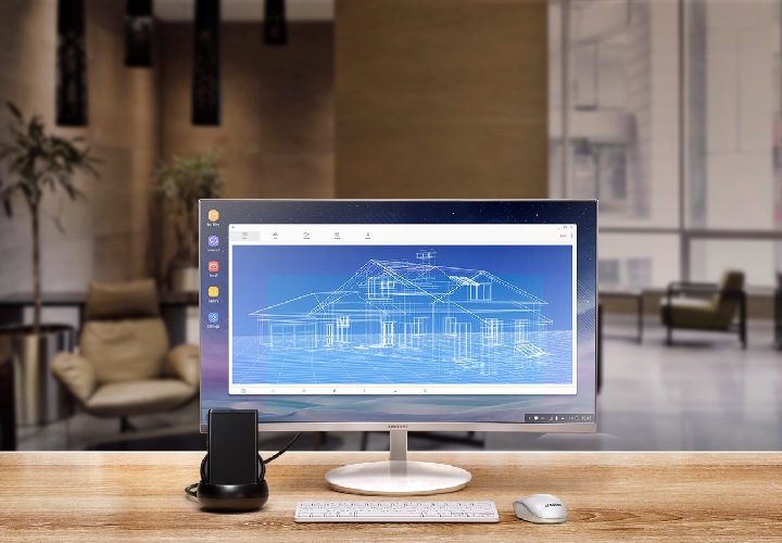 Image of Galaxy Note8, Samsung DeX station, monitor, keyboard, and mouse set up in a hotel lounge