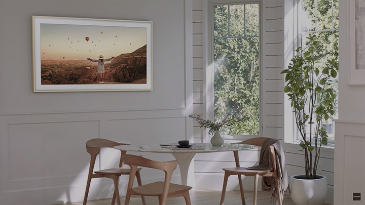 Samsung The Frame TV becomes a photo frame by using Art Mode to display a personal picture.