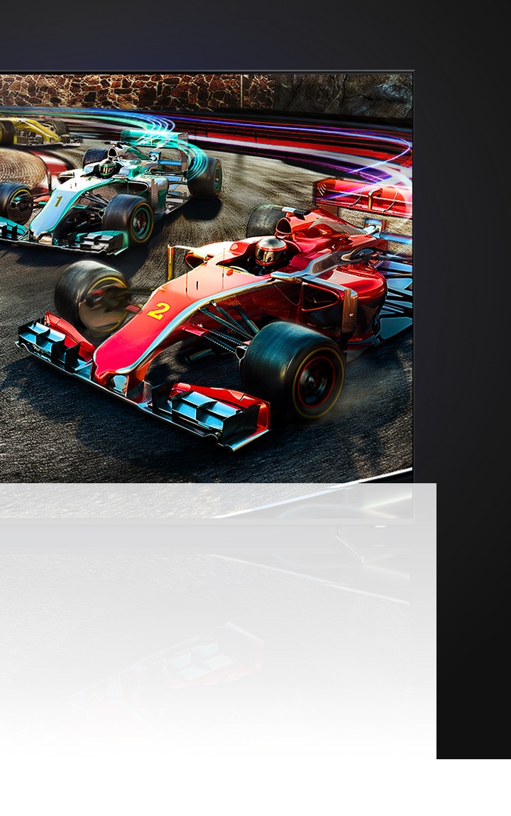 Игровой телевизор, на экране которого изображены синий и красный болиды Formula 1, соревнующиеся в заезде на треке.