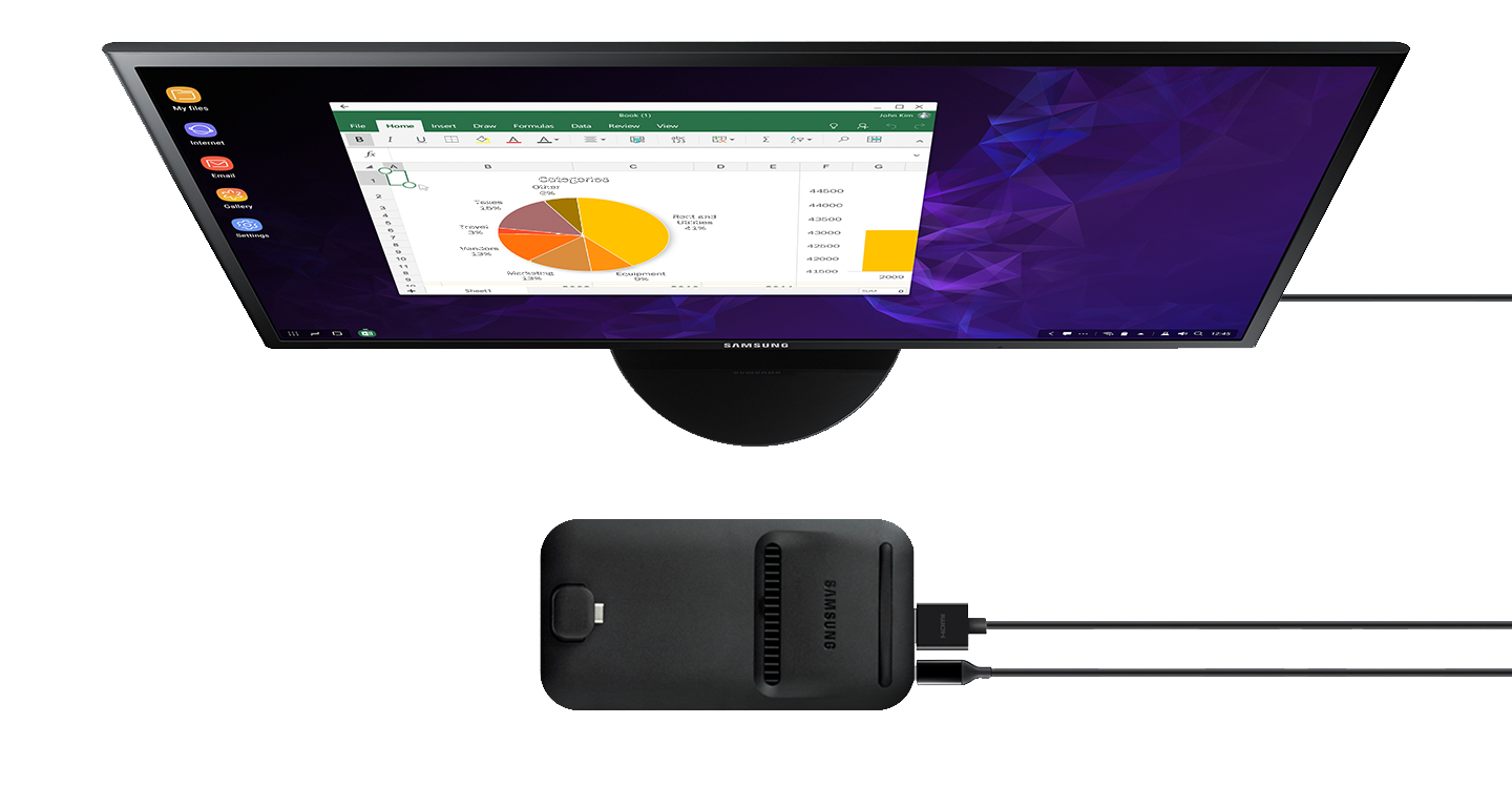 Galaxy S9 or S9+ with a spreadsheet on-screen sliding onto Samsung DeX Pad in front of a Samsung monitor