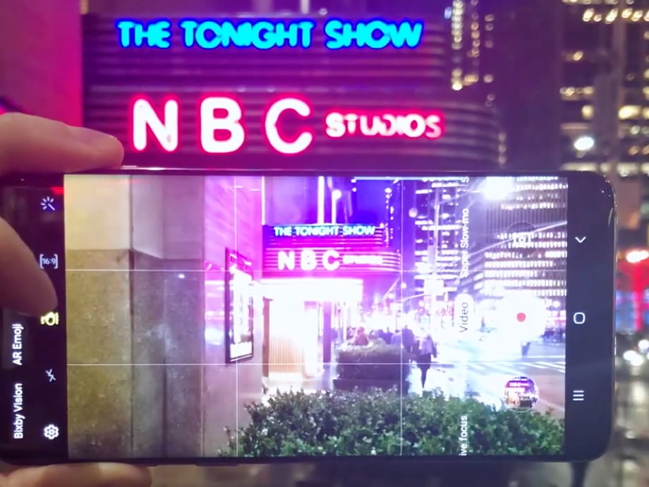 Red and blue neon marquee of NBC Studios/The Tonight Show at the GE Building in New York City captured on a Samsung Galaxy S10+ smartphone.