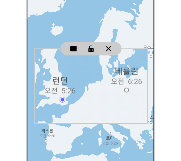 돋보기 창을 사용하여 세계 지도에서 런던과 베를린을 살펴보고 있습니다.