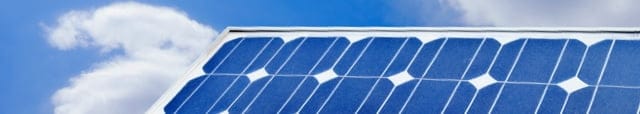 Close-up of solar panel against a blue sky.