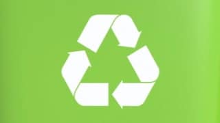 Recycling logo against a green background.