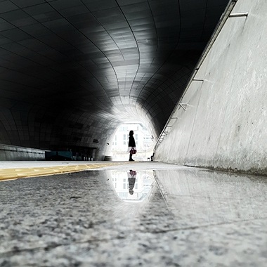 A photo captured with Galaxy by Instagram user @kiks_way of a person standing backlit in a circular entryway