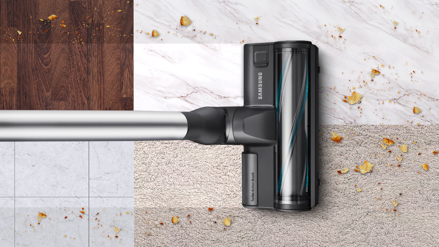 A woman uses a Samsung Vacuum Cleaner with Visionary Mapping