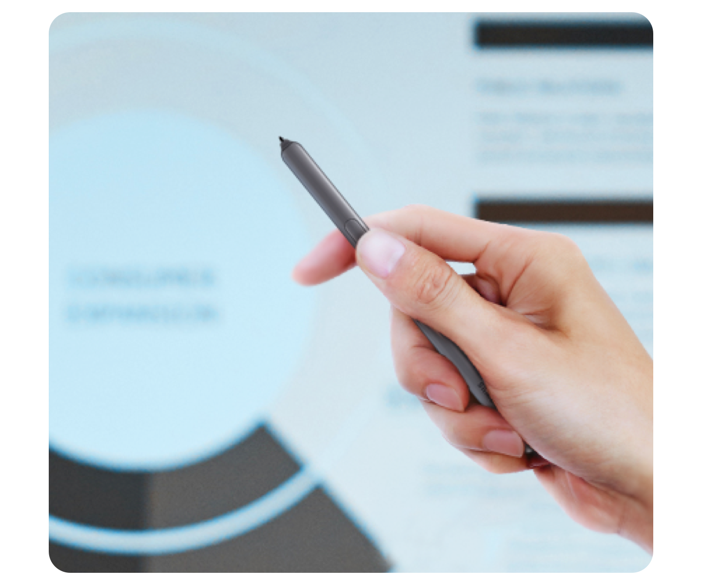 A right hand holds a grey Samsung S Pen, using the S Pen Bluetooth connectivity to control the presentation in the background