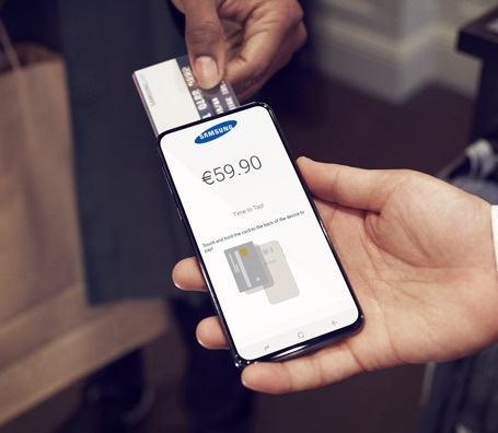 Two people showing card payment option on Samsung rugged mobile phone