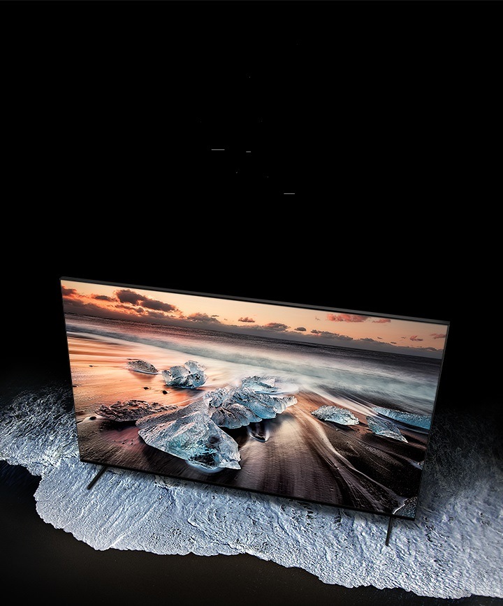 A top view of gray QLED 8K TV with a stand sitting on a gray floor