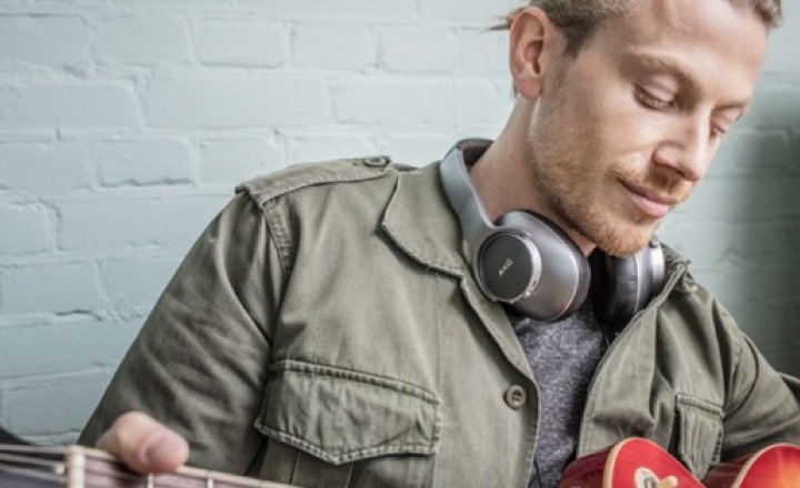 Front view of a man wearing AKG wireless headphones representing father's day gift for music-mad dads