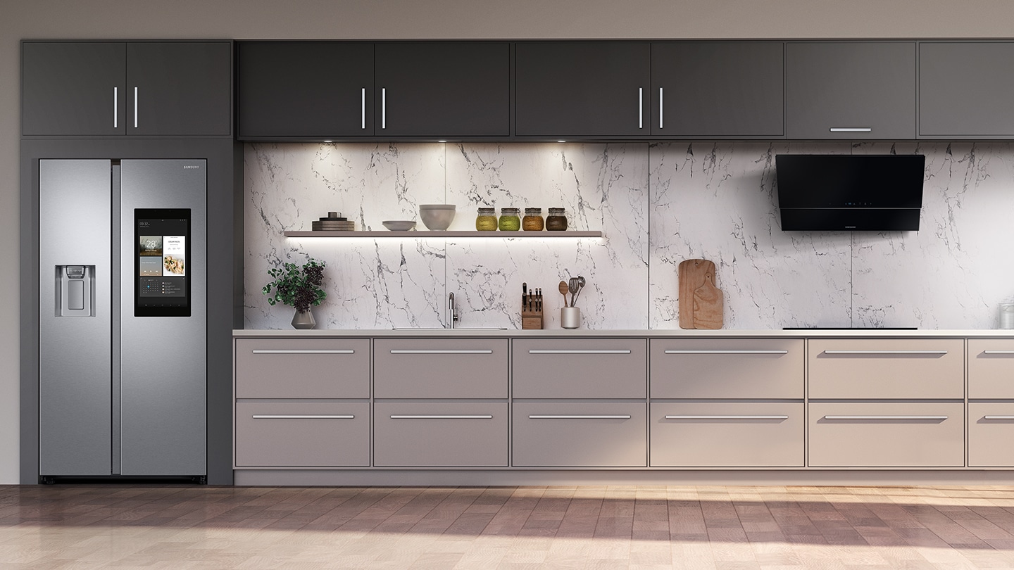Landscape photo of modern kitchen fitted with Sa msung home appliances. Modern kitchen with Samsung Family Hub refrigerator, hob and cooker hood.