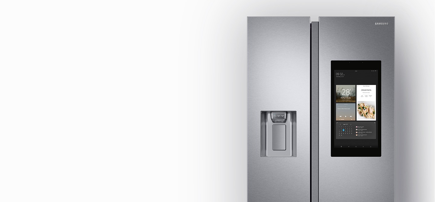 Samsung smart fridge with a water dispenser. Silver Samsung Family Hub refrigerator with water dispenser.