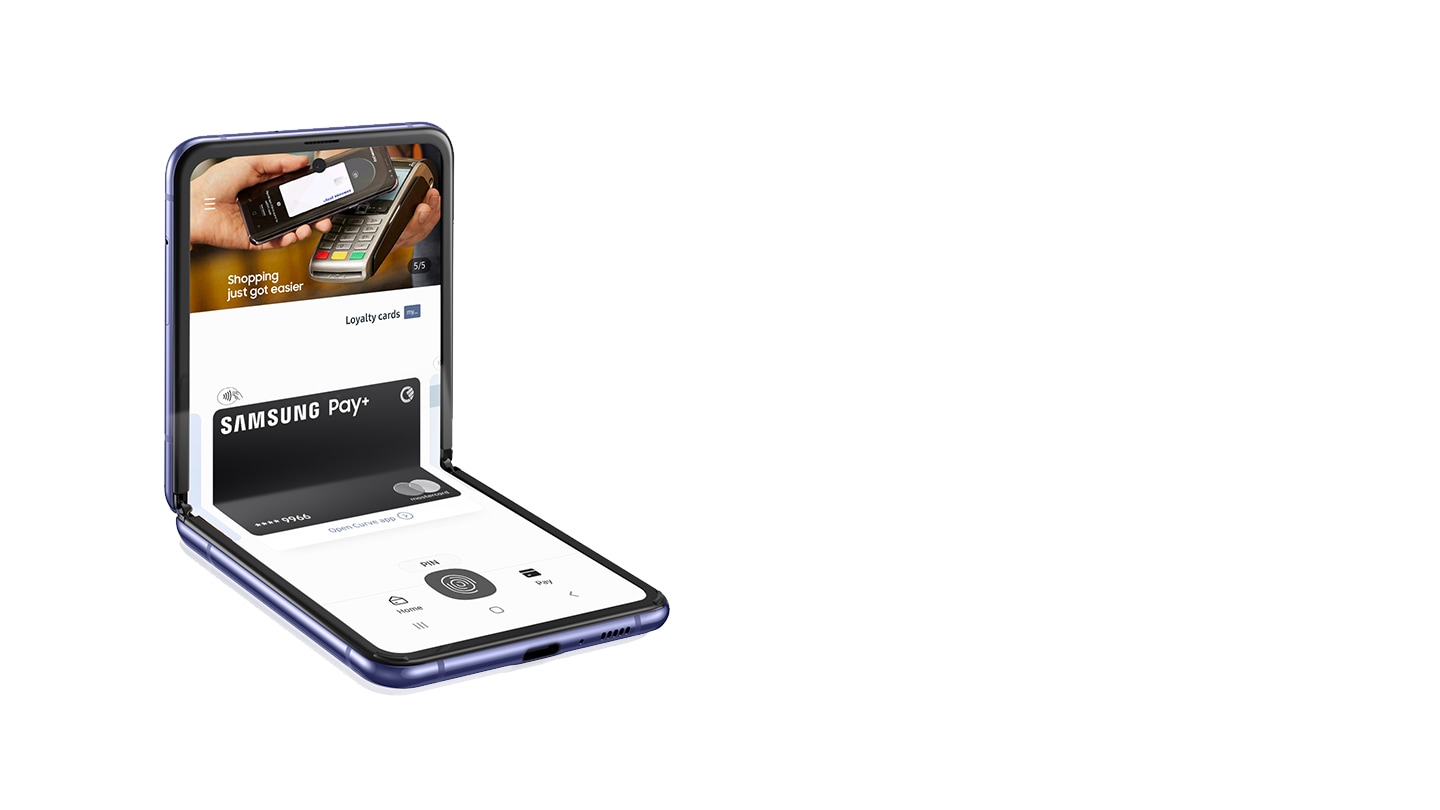 A black Samsung smartphone showing contactless Samsung Pay on its screen is held by a hand in front of a white background. A black Samsung smartphone showing contactless Samsung Pay on its screen is held by a hand in front of a white background.