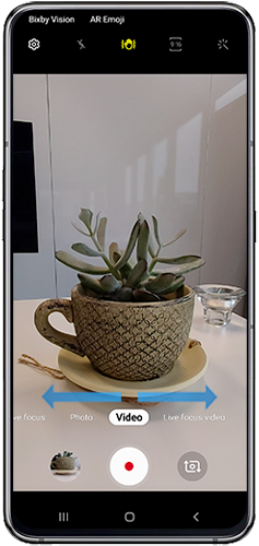Swipe left or right until the Photo or Video function