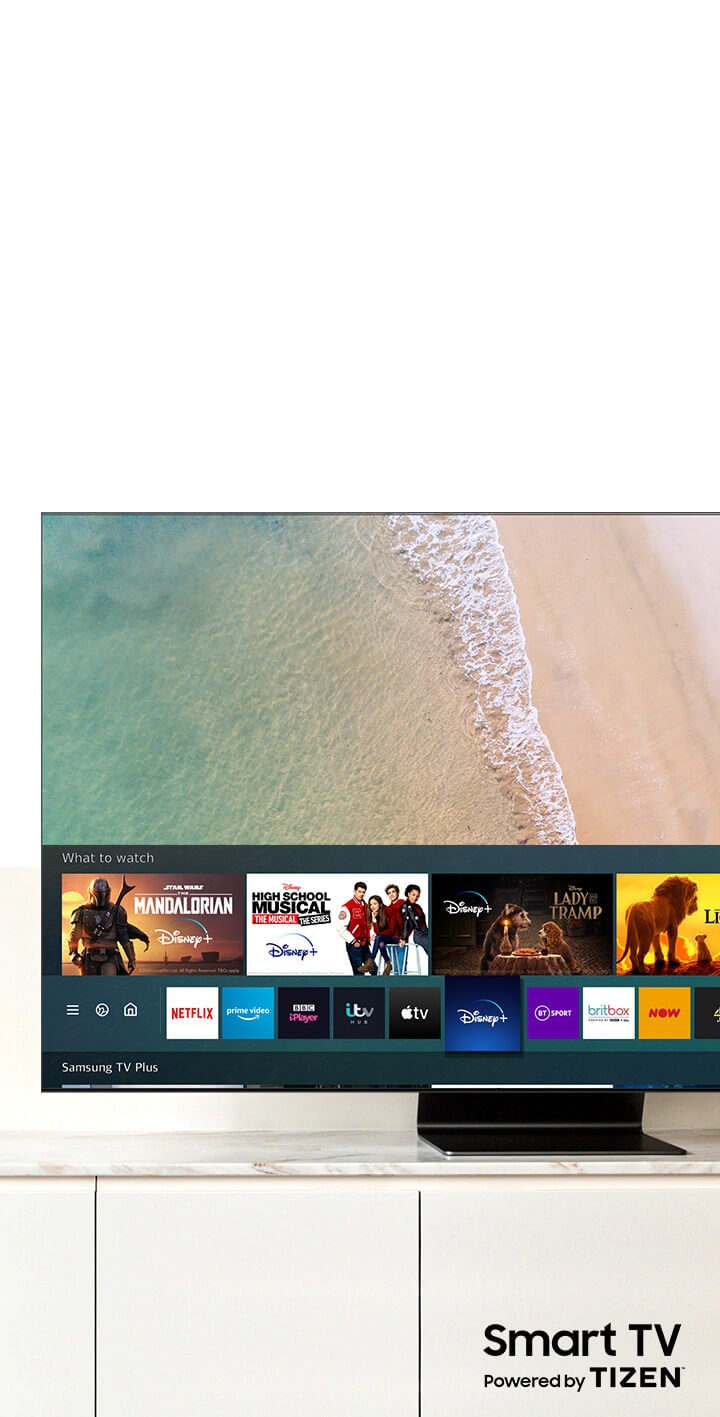 A Samsung QLED TV is showing Smart Hub, Samsung Smart TV platform, on the screen. Smart TV powered by TIZEN logo is under the TV.