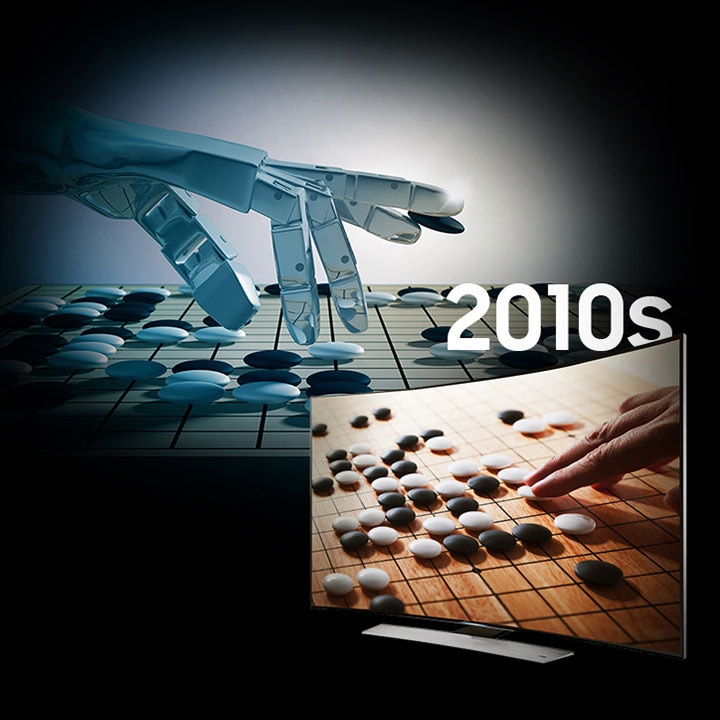 Background image of a robot hand playing a game of Go, next to a 2010’s era with curved display television screen showing a go board with a person’s hand poised to make a move.