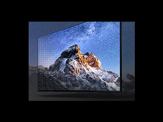 The image of a mountain top bleeds outside of a QLED 8K screen demonstrating how realistic the images are on this top of the line screen.