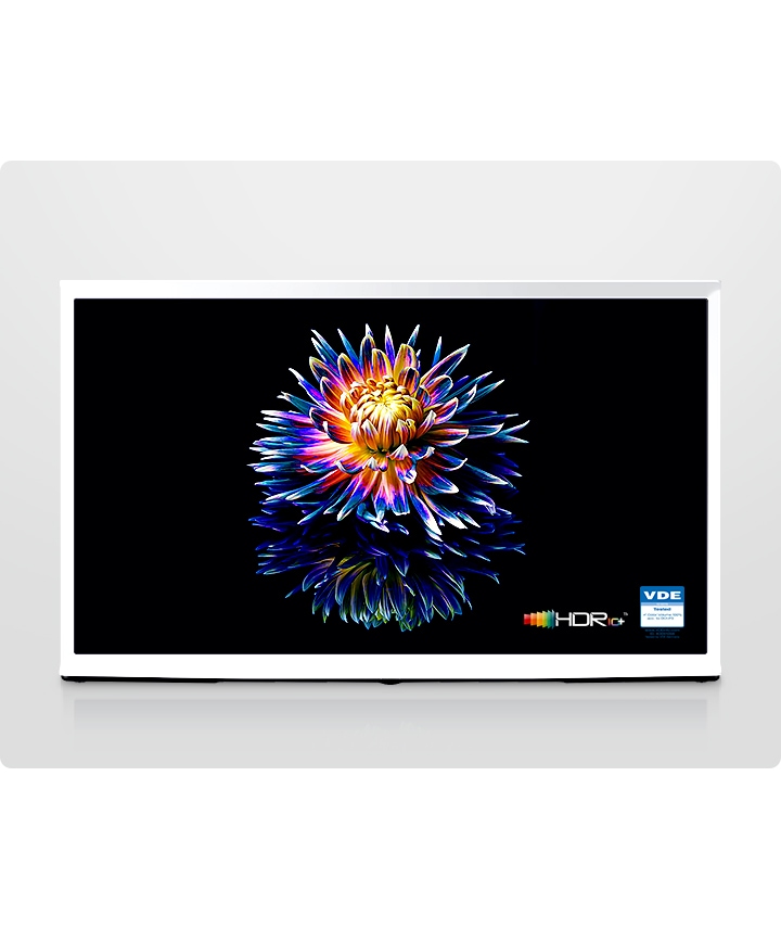 A Cloud White model of The Serif shows a colorful flower on a black screen with quantum dot technology.