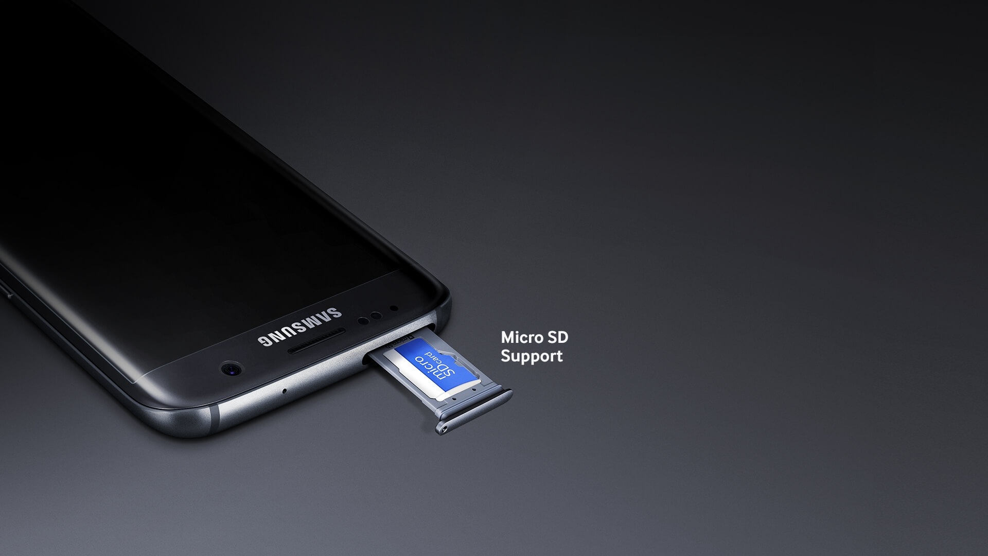 A close-up detail of the Galaxy S7 edge (black), showing a microSD card inside the device's microSD slot, along with the text 'microSD support'.