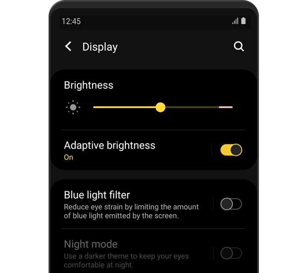 The 'Display' menu is displayed. Adaptive brightness is turned 'on'.