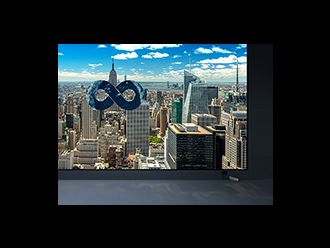A city skyline as shown on a QLED 8K screen.