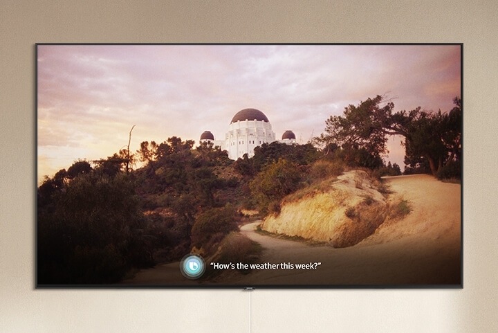 Voice command on Smart TV with the caption "How's the weather this week?"