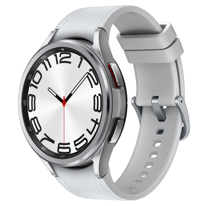 A silver Galaxy Watch6 Classic with a silver hybrid eco-leather band at a tilted angle is shown.