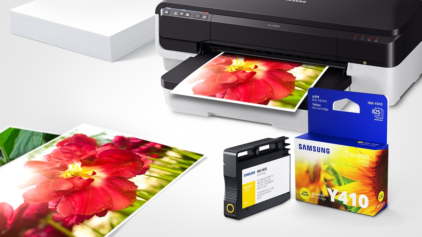 위쪽 삼성 프린터에서 출력물이 나오고 있고, 아래쪽 INK-y410 제품과 박스가 있습니다.