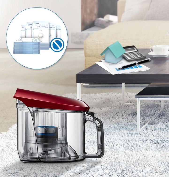 먼지봉투가 필요없다는 아이콘 표시와 함께 카펫트 위에 진공청소기 본체 왼쪽 모습이 보입니다.