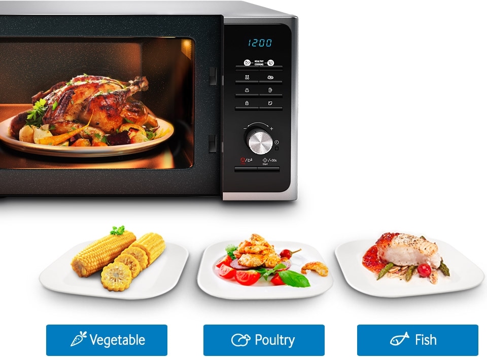 A plate of chicken and vegetables is being prepared inside a black Samsung Solo Microwave Oven, demonstrating how Samsung microwaves can be used to cook with fresh ingredients