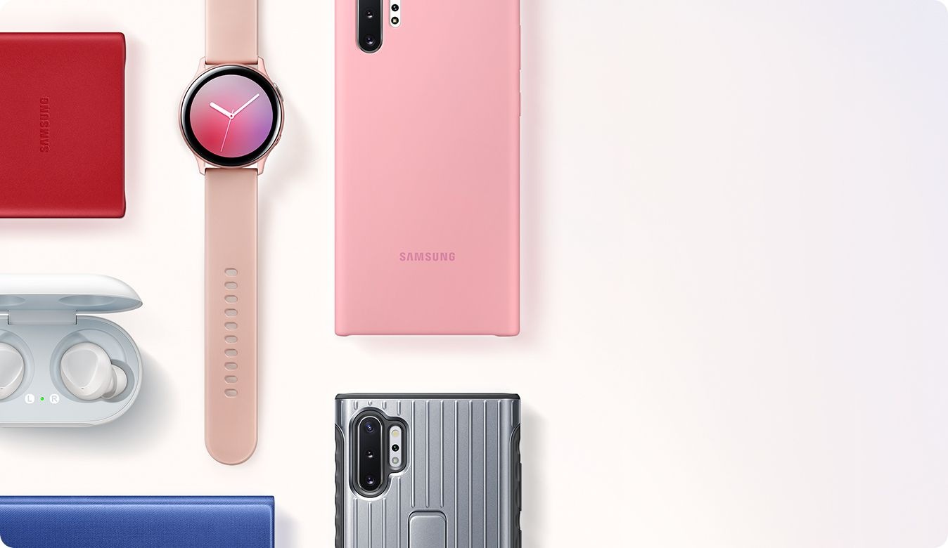 A flat lay of various accessories including LED View Cover, Galaxy Watch Active2, Galaxy Buds, Silicone Case, and Protective Standing Cover