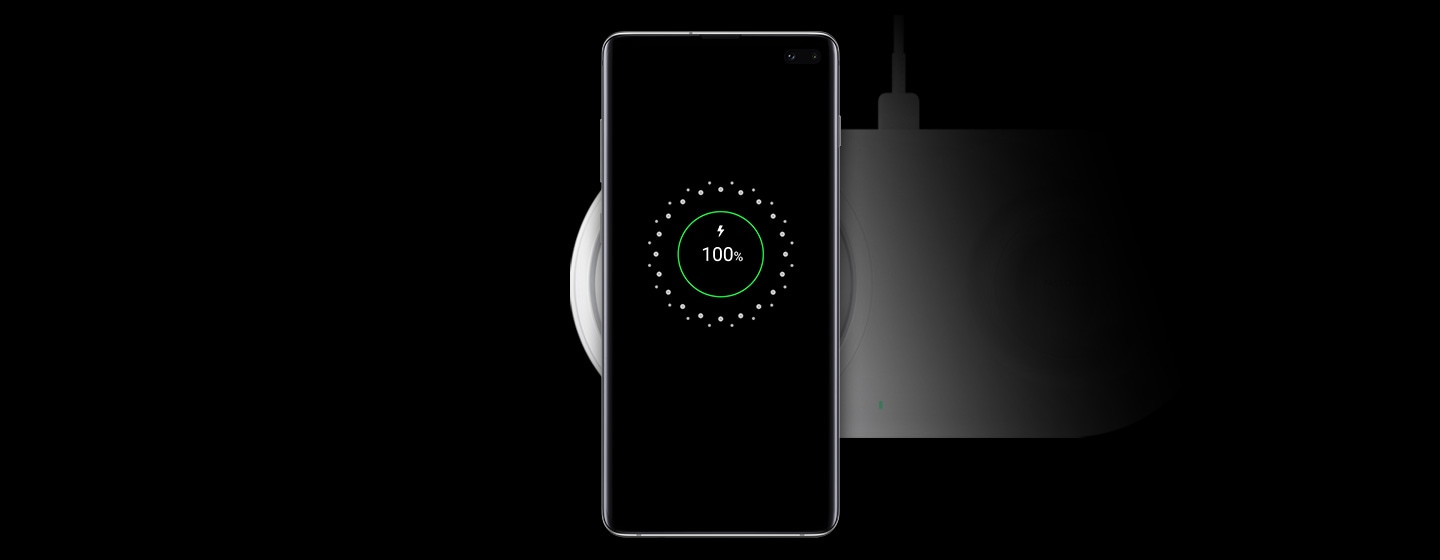 Wireless Charger Duo Pad in White shown charging the Galaxy S10 plus in Prism White.