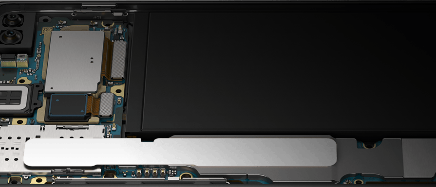 The Galaxy S10+ in landscape mode, propped up at a slight angle from the Bixby and volume button side with the interior hardware revealed, showing the pieces that make the Galaxy S10+ optimised for gaming.
