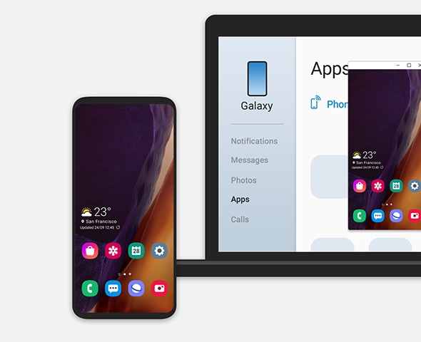 Mobile and laptop are side by side, and the mobile home screen is activated on the laptop screen.