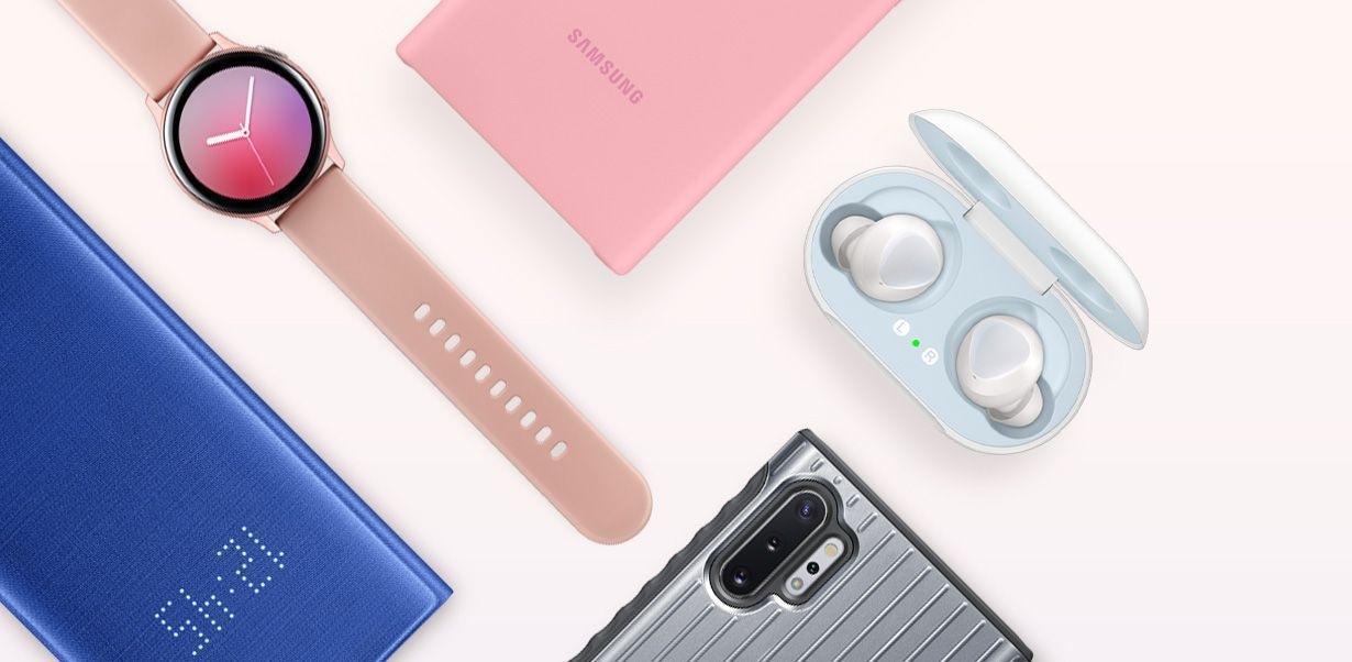 Flat lay of several accessories including LED View Cover, Galaxy Watch Active2, Galaxy Buds, and Protective Standing Cover