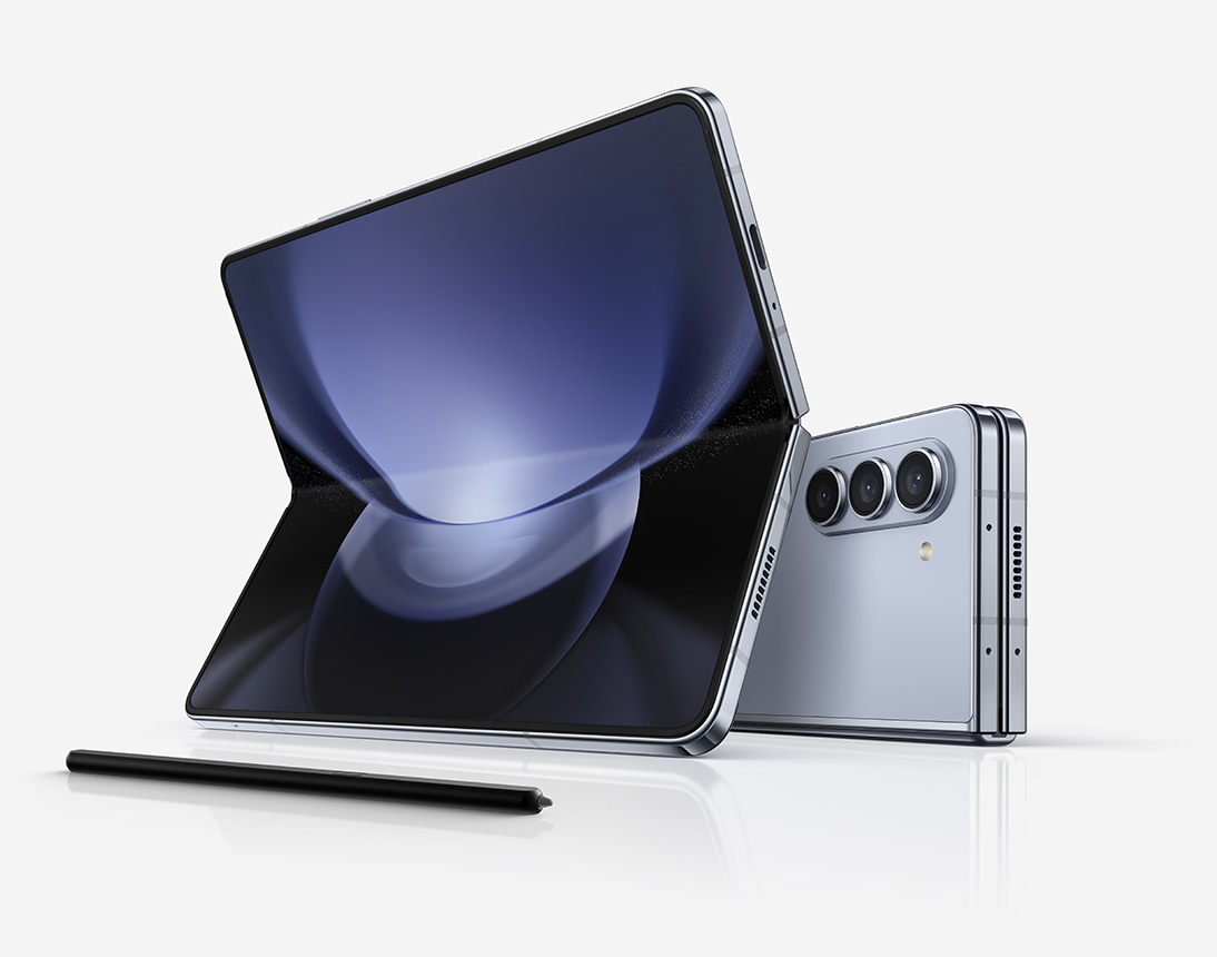 Two Galaxy Z Fold5 devices placed horizontally. One is folded and seen from the rear and the other is unfolded and seen from the Main Screen. S Pen Fold Edition for Galaxy Z Fold5 lies in front.