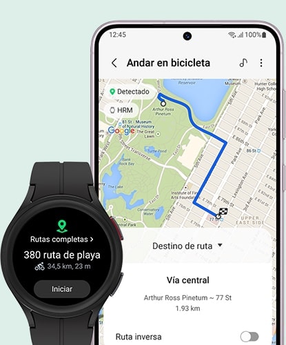 Un Galaxy Watch5 Pro en Black Titanium muestra la pantalla de inicio de un objetivo de ruta. La información incluye la dirección y la distancia. Junto a ella, una pantalla de un teléfono inteligente muestra el destino de la ruta usando Google Maps.