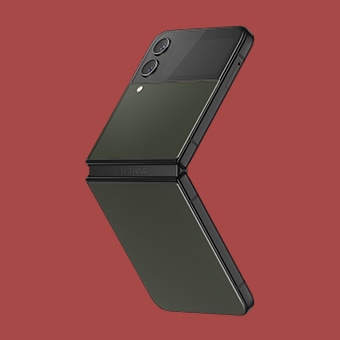 Galaxy Z Flip4 in Flex mode seen from an angle that shows its custom Bespoke Edition khaki front and rear panels and black frame.
