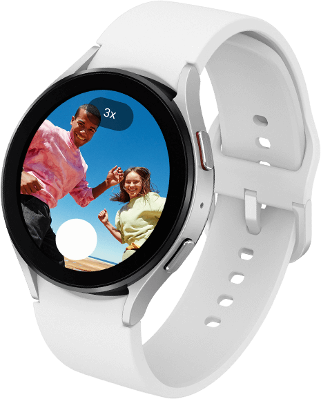 A Galaxy Watch5 displaying a selfie preview with 3x zoom and a shutter button on its screen.